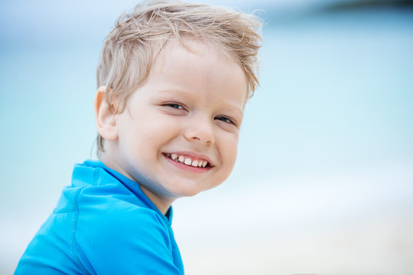 Smiling little boy on the beach